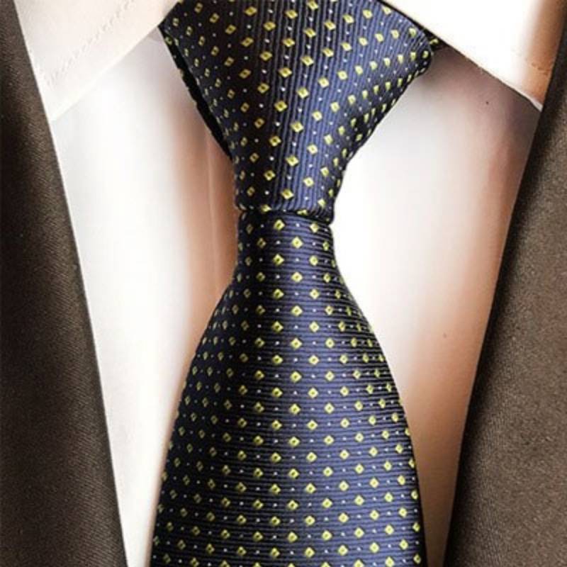 Tamsiai mėlynas kaklaraištis su geltonais ir baltais taškeliais